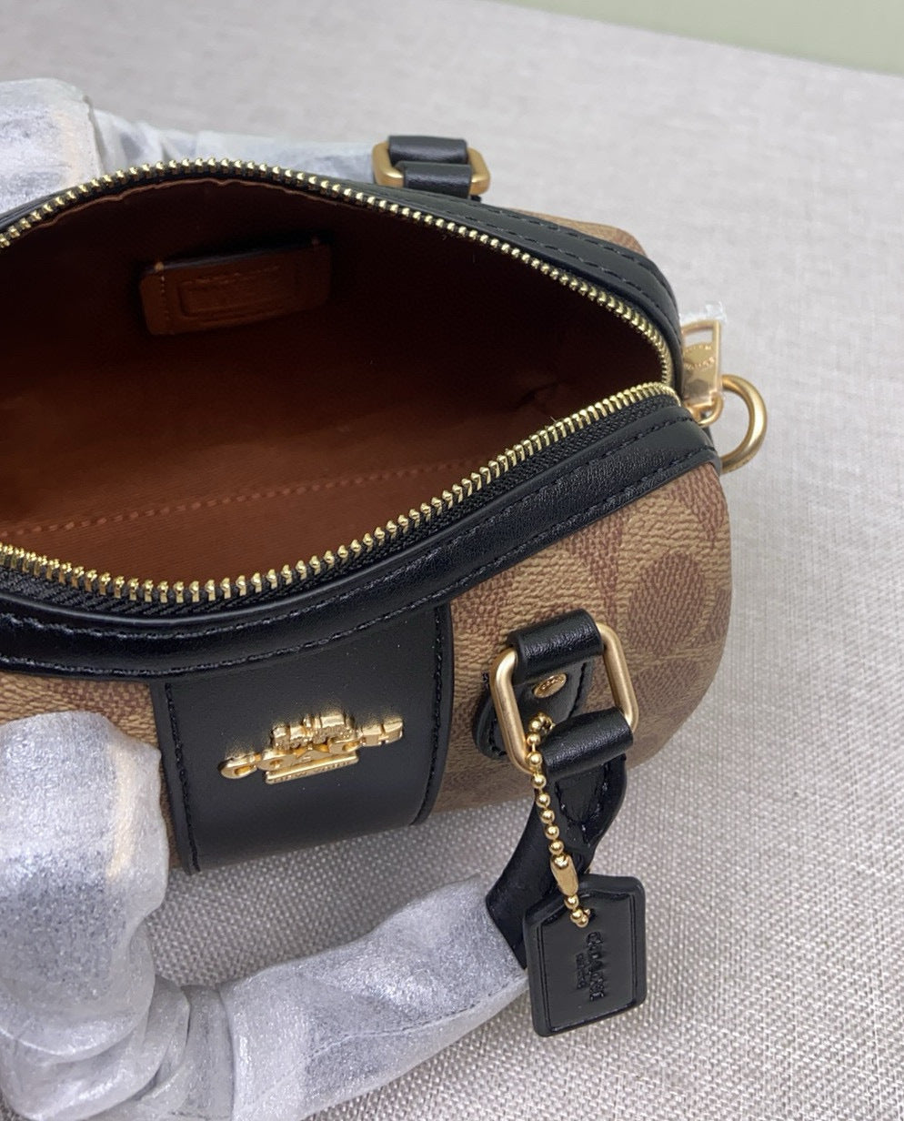 Le sac seau Boston Rowan de Coach
