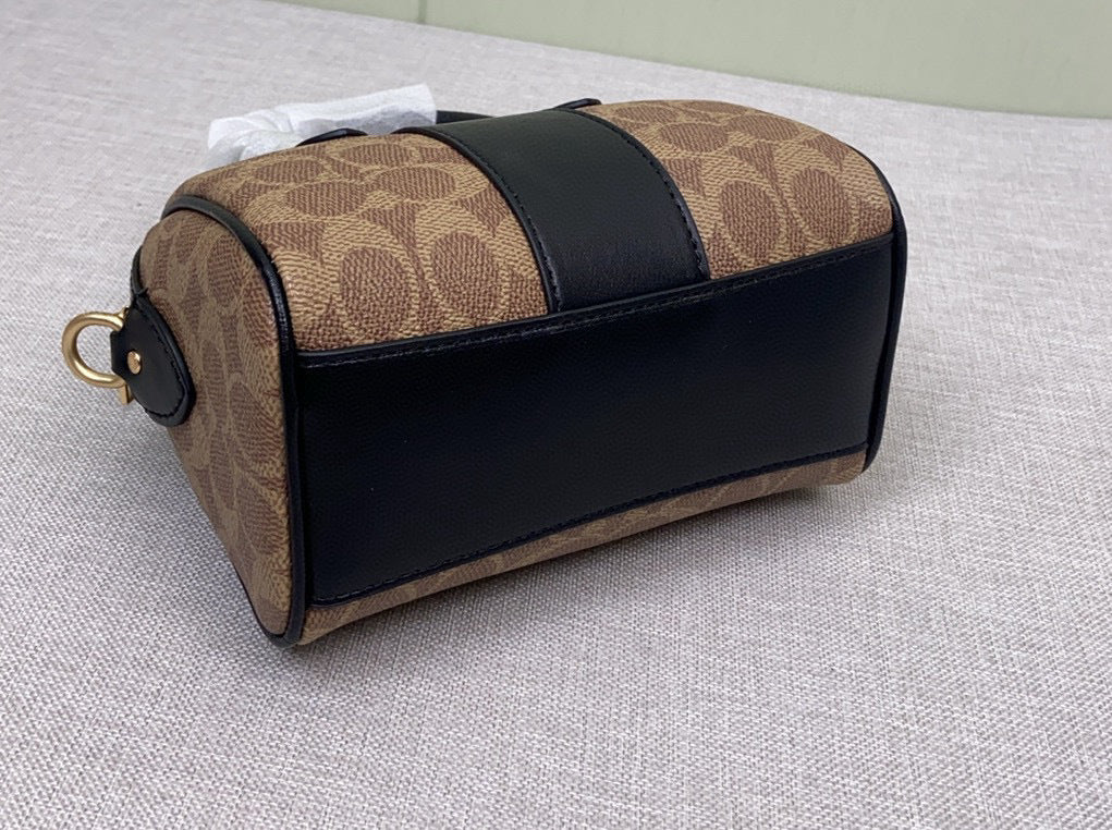Le sac seau Boston Rowan de Coach
