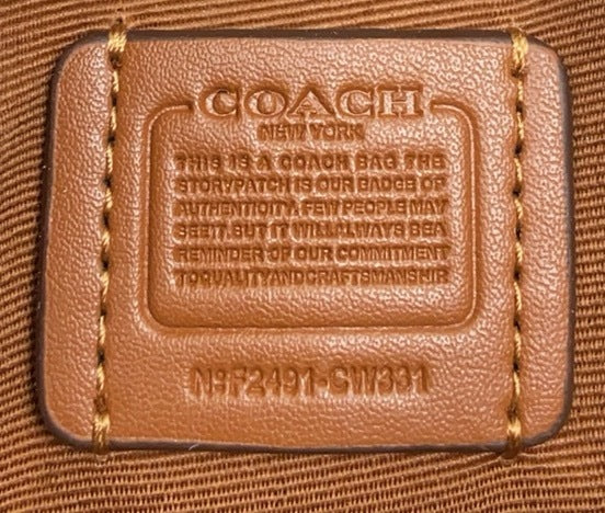 Le sac seau Boston Rowan de Coach