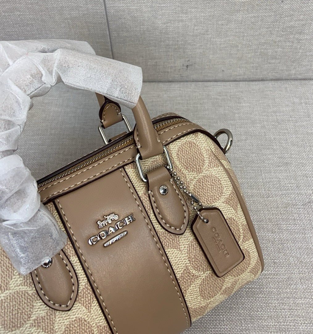 Le sac seau Boston Rowan de Coach
