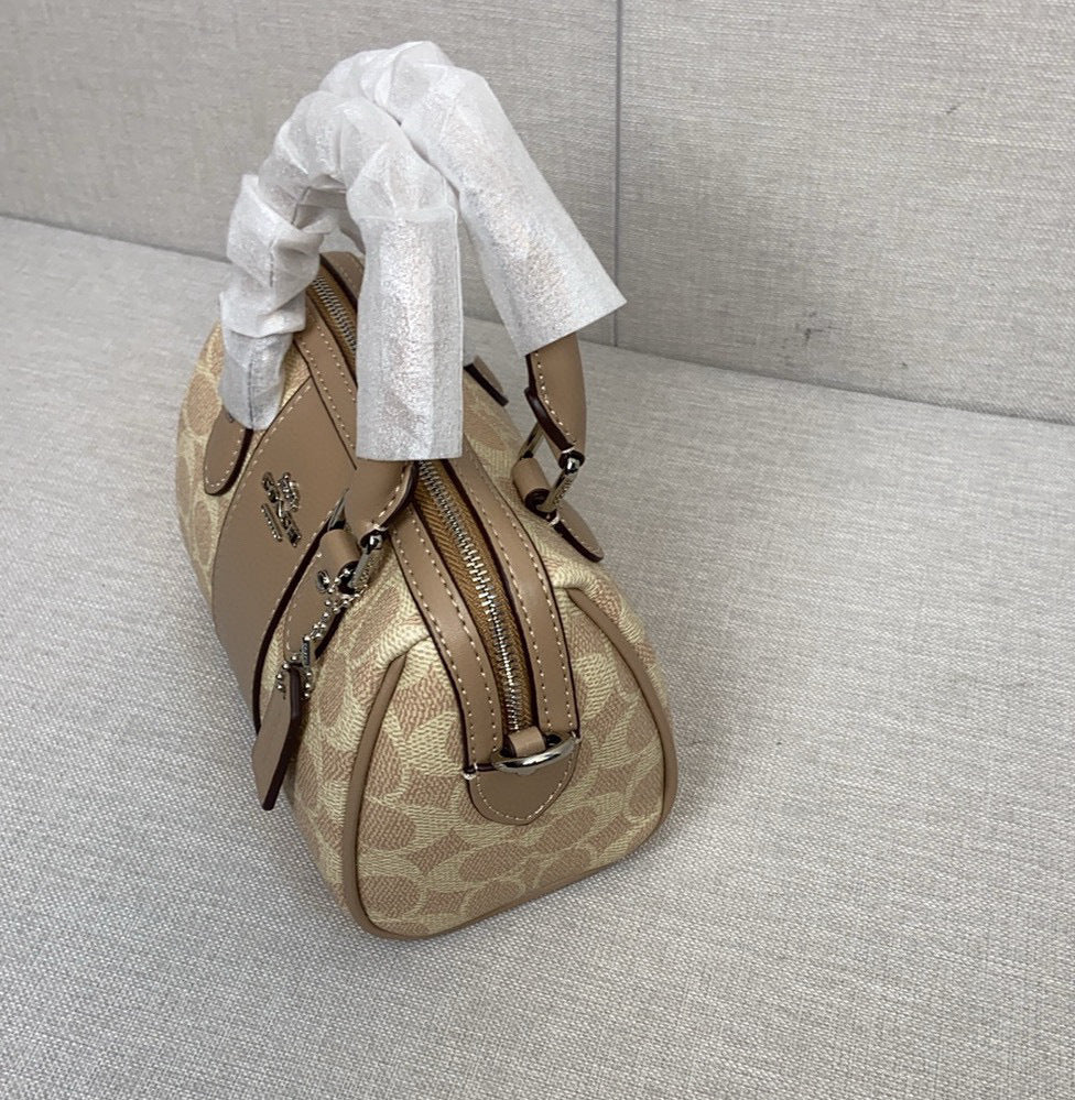 Le sac seau Boston Rowan de Coach