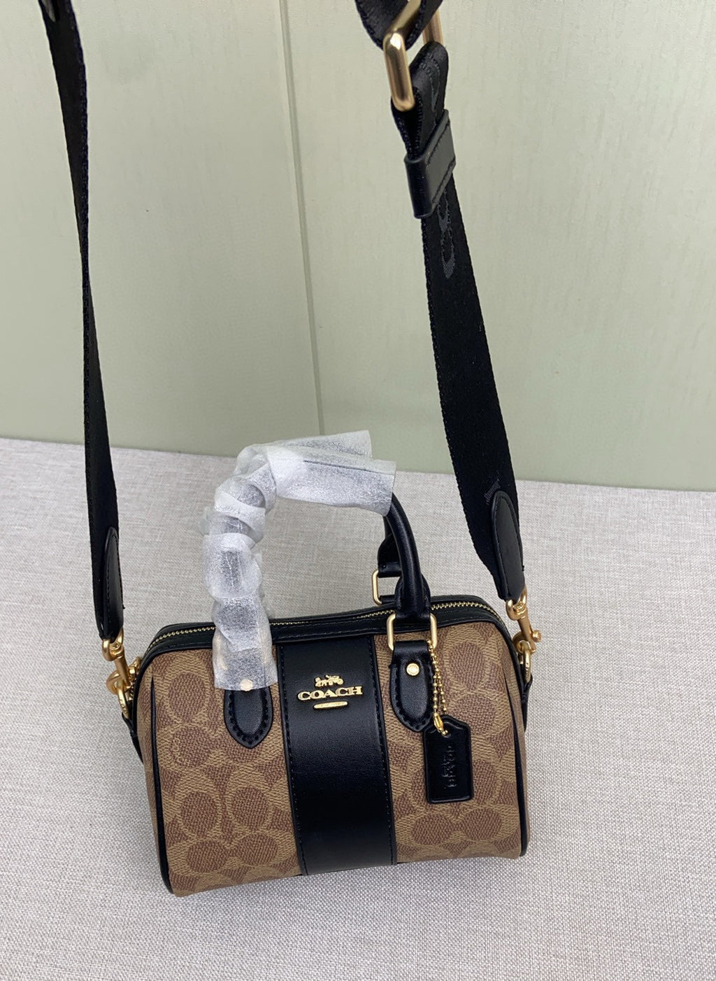 Le sac seau Boston Rowan de Coach