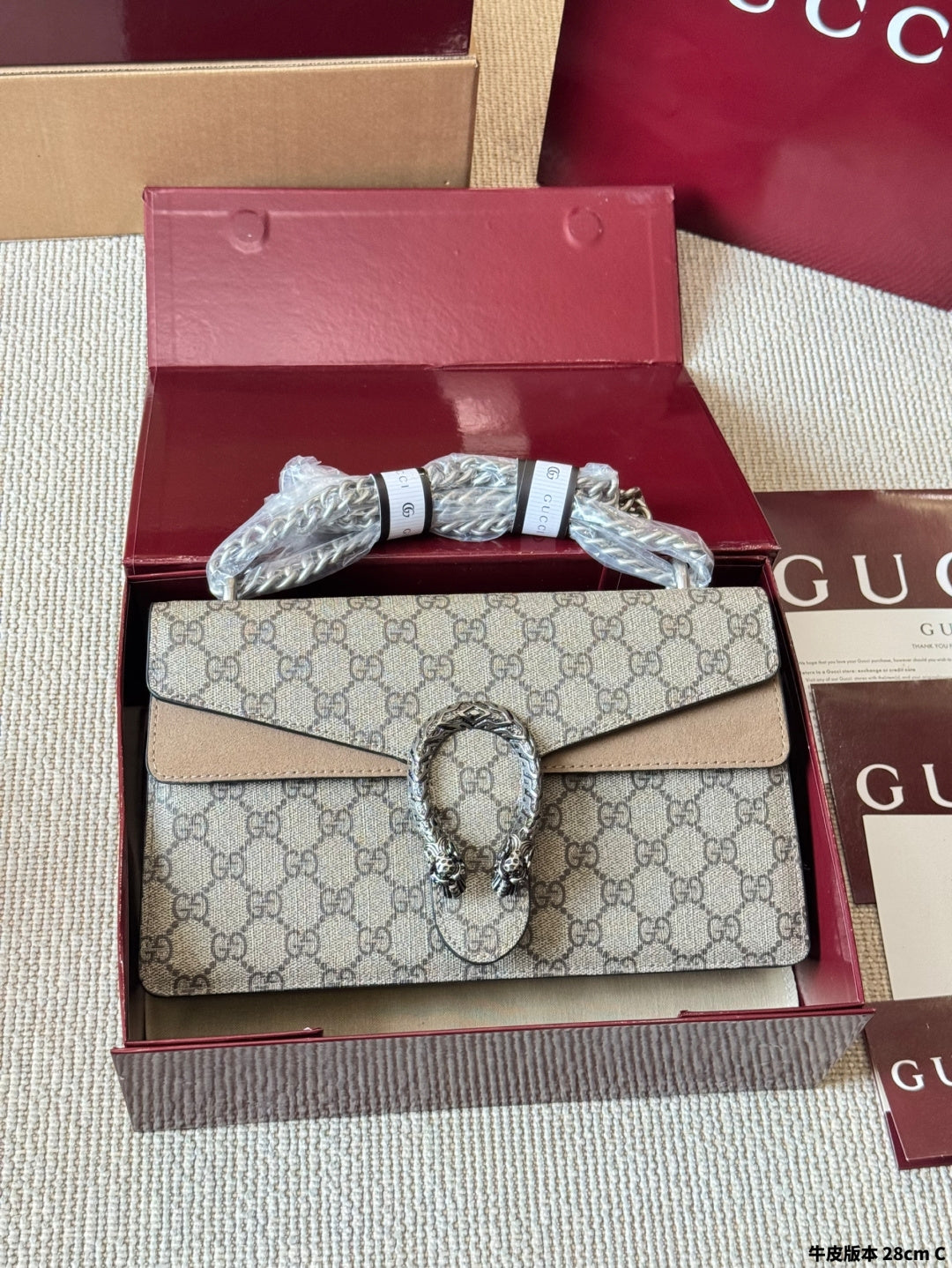 Sac Dionysus en toile monogramme avec fermoir tête de tigre