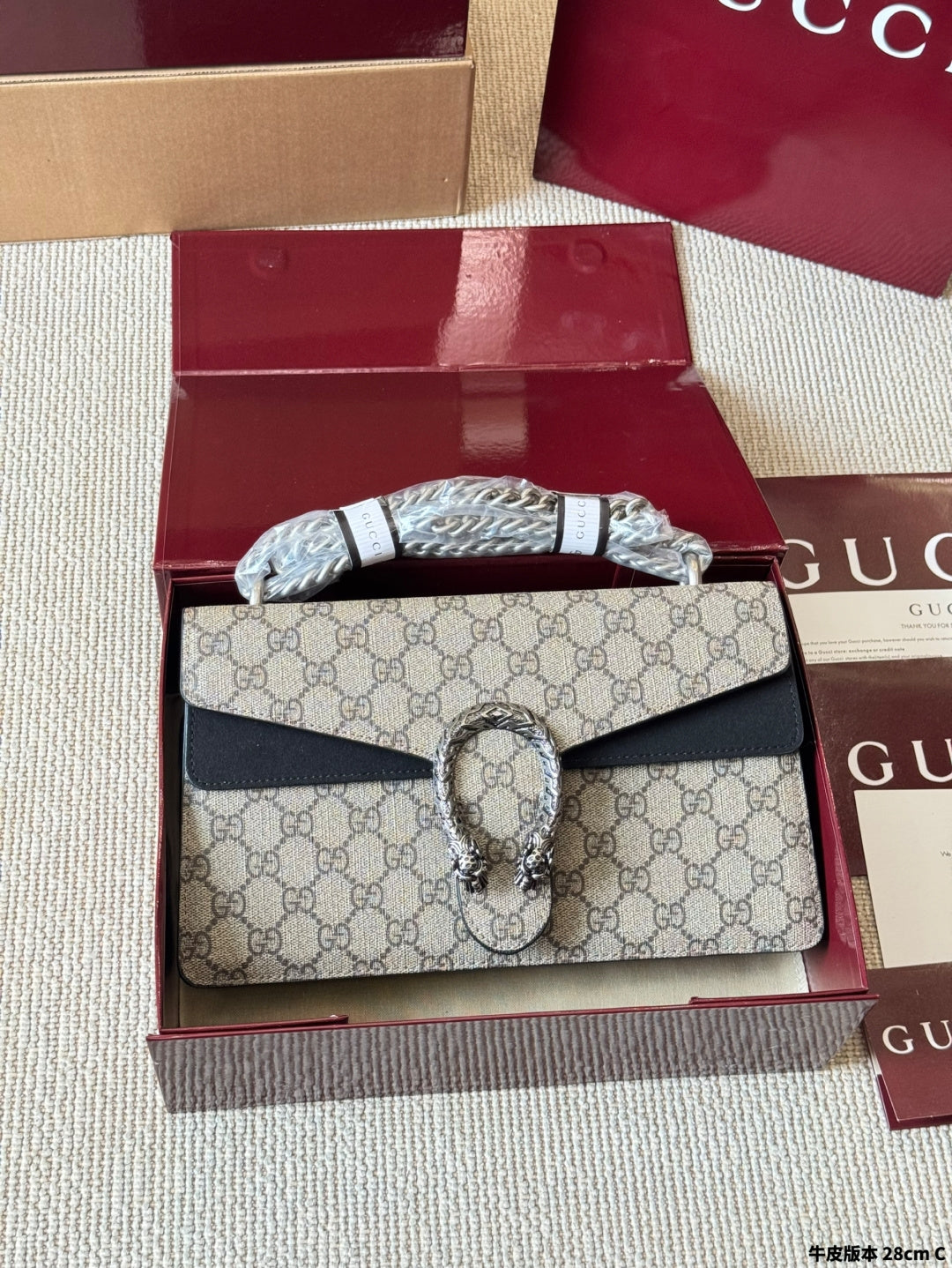 Sac Dionysus en toile monogramme avec fermoir tête de tigre