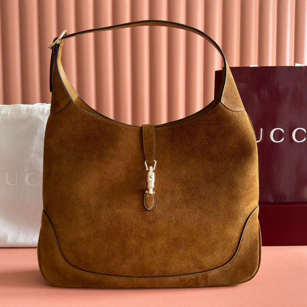 Sac Jackie 1961 en daim avec fermoir piston